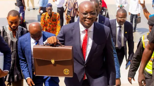 Finance minister on im way to parliament with bag containing budget 