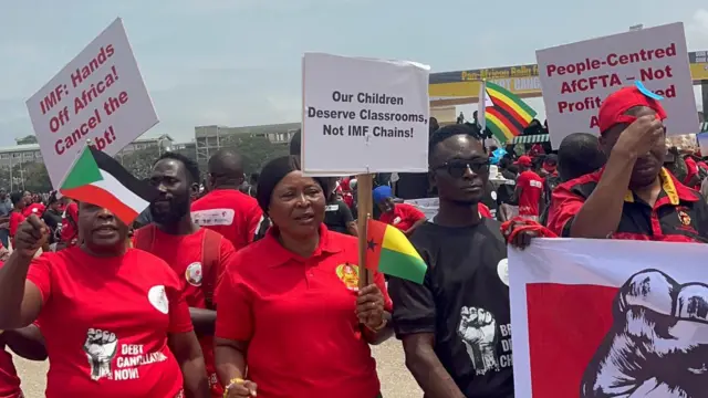 Women holding placards