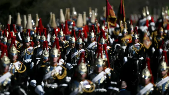 A Sovereign Escort of di Household Cavalry, gather ahead of di arrival of King Charles III and Queen Camilla to receive President of Nigeria Bola Ahmed Tinubu and First Lady Oluremi Tinubu at Datchet Road in Windsor