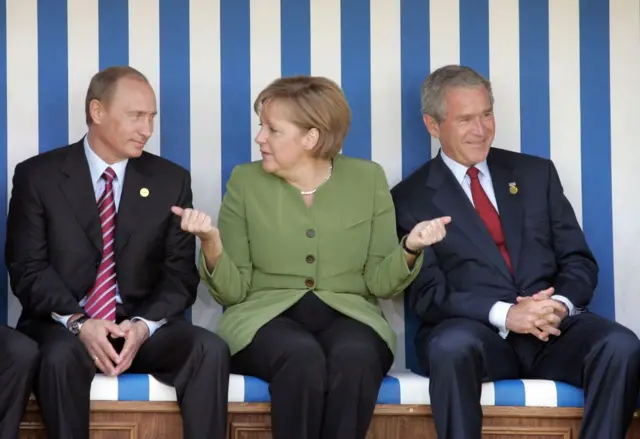 Vladimir Putin, Angela Merkel, George W. Bush 