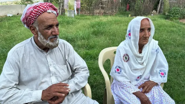 Abdul Jabbar's mother and father seated