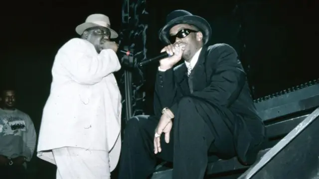 Combs (right) and Biggie Smalls performing in 1994