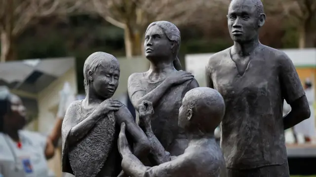 A bronze statue commemorating the 30th anniversary of the eradication of smallpox stands outside the World Health Organization (WHO) headquarters in Geneva, Switzerland