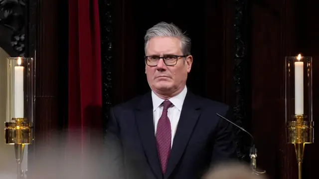 Sir Keir Starmer dey look from one pew inside Canterbury Cathedral wit solemn expression