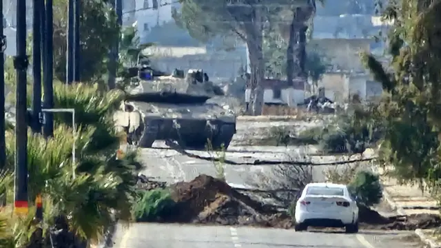 An Israeli tank enters Quneitra, a largely empty Syrian town on the Golan Heights.