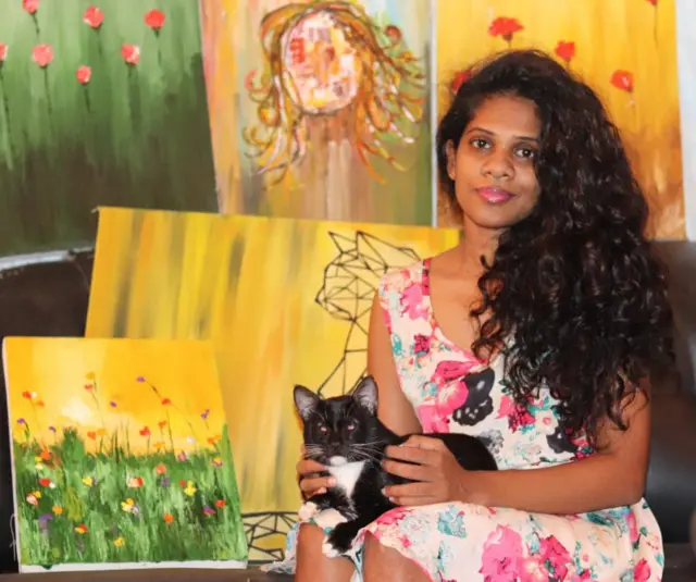 Thilini and her artwork 