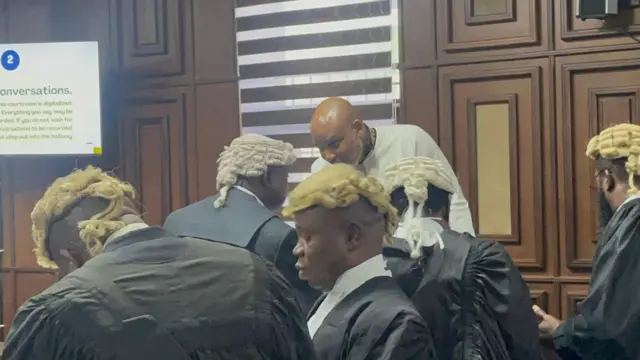 Nnamdi Kanu conferring with one of his lawyers, Uchenna Njoku (SAN) in court on Friday, September 26, 2025