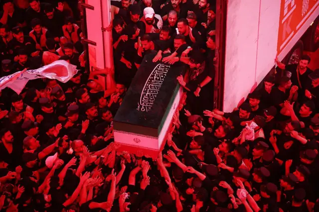 Mourners take part in the funeral procession of Iran's late supreme leader Ayatollah Ali Khamenei at Imam Hussein Shrine in Karbala early on July 9, 2026