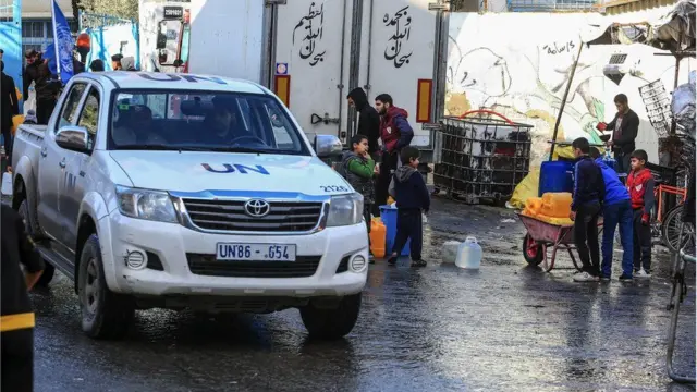 Palestinians collect drinkable water provided by UN mobile tankers amid acute shortages of food, clean water and medicine due to Israeli attacks, in Rafah, Gaza on 29 January, 2024
