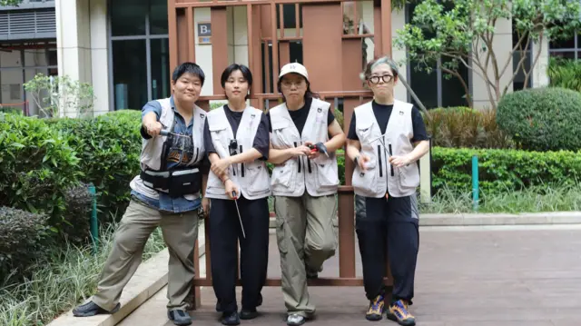 Liu Mengyuan stands on the left side along with three other members of her all-women repair crew 's Zhenji Women Workers.