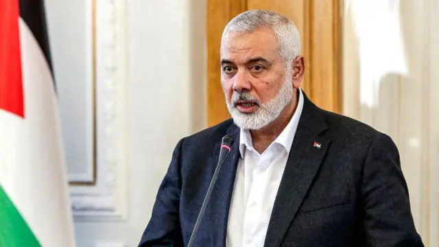 Ismail Haniyeh, the Doha-based political bureau chief of the Palestinian Islamist movement Hamas, speaks to the press after a meeting with the Iranian foreign minister in Tehran in March 2024