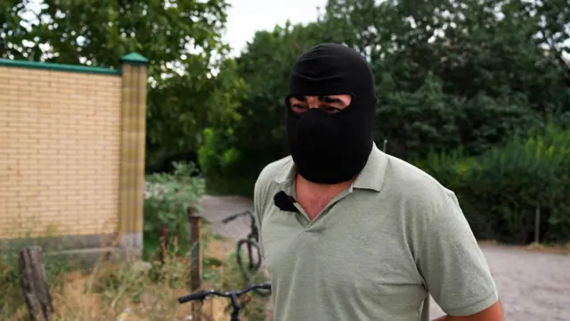 a man in balaclava