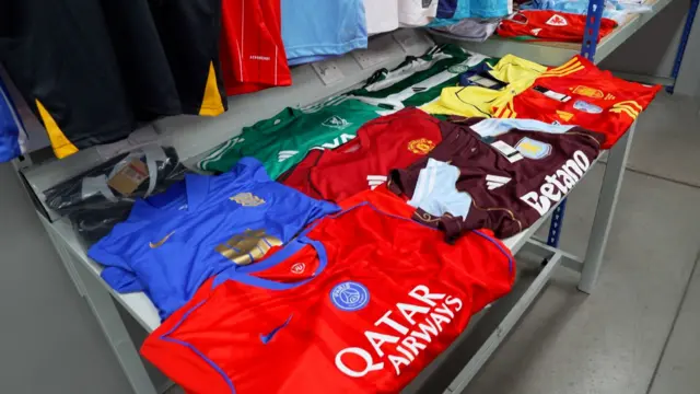 Counterfeit strips laid out on a table which have been seized by Border Force