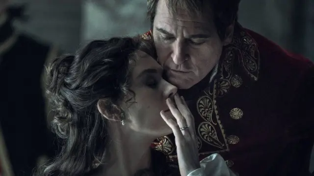 Joaquin phoenix as Napoleon leans over his first wife, Josephine (played by Vanessa Kirby
