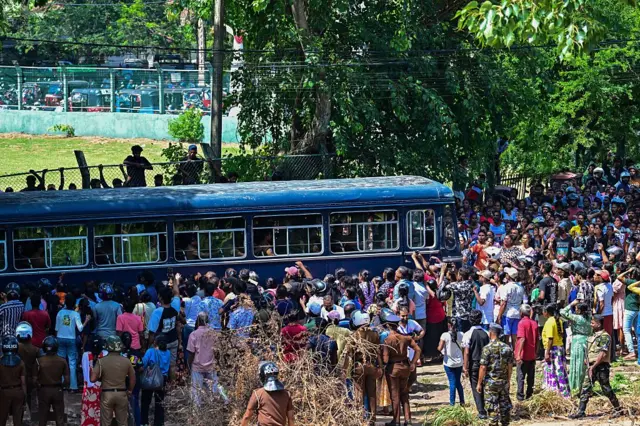 A bus carrying prisoners to be transferred to another jail makes its way following overnight clashes between inmates of two drug gangs at Negombo prison near Colombo on July 6, 2026.