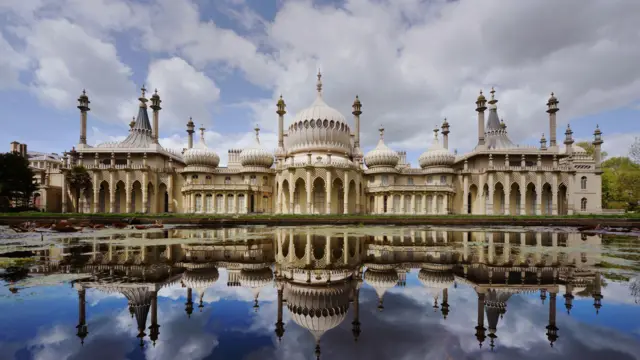 Brighton Royal Pavilion, with its numerous domes and minarets, reflected onto a lake