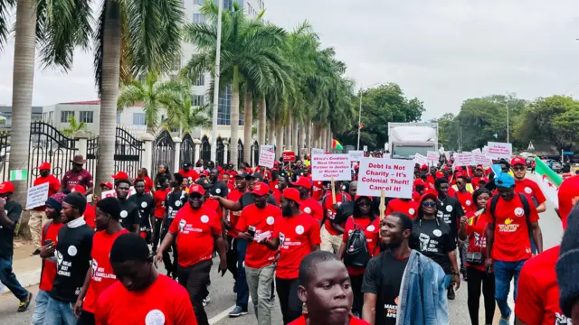 Pipo wear red clothes carry placards to protest