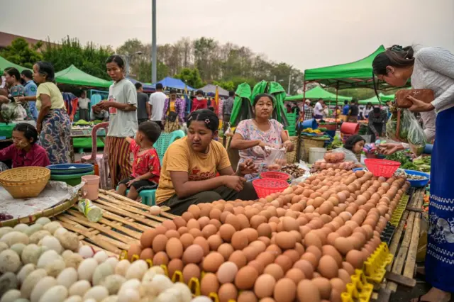 
MYANMAR-LIFESTYLE-MILITARY-COUP
Vendors wait to sell eggs to customers at Myo Ma market in Naypyidaw on March 26, 2024. Myanmar's junta prepared to put on a show of force at the annual Armed Forces Day parade as it struggles to contain escalating violence against its rule. (Photo by AFP) (Photo by STR/AFP via Getty Images)