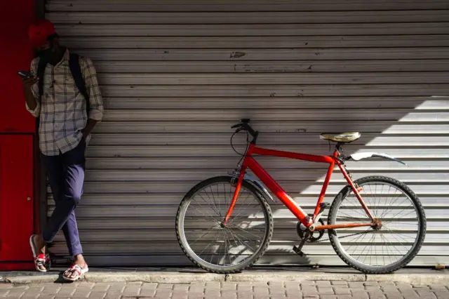 A young man using a mobile phone, in Colombo.