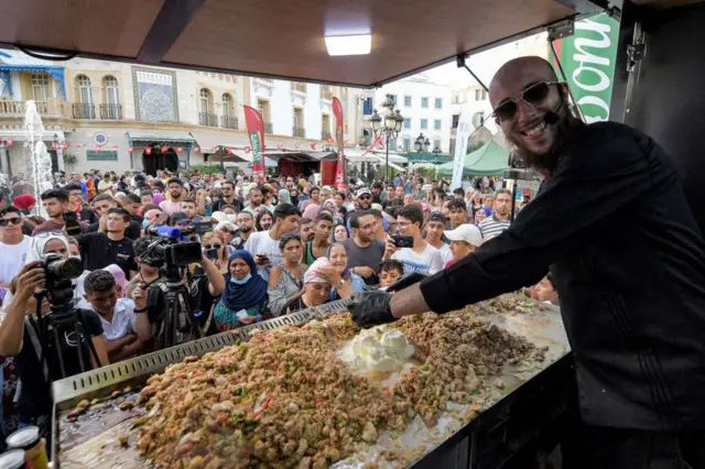 On the same day, well-known street food cook Habib el-Bey gets to work in his van on Habib Bourguiba Avenue, in Tunisia's capital city.