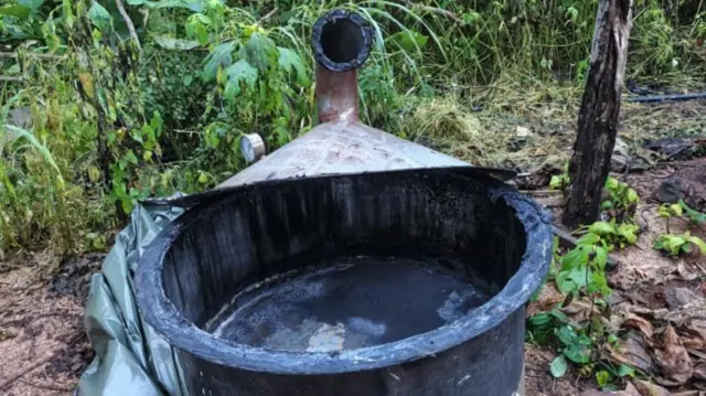 One big black pot wit chemicals