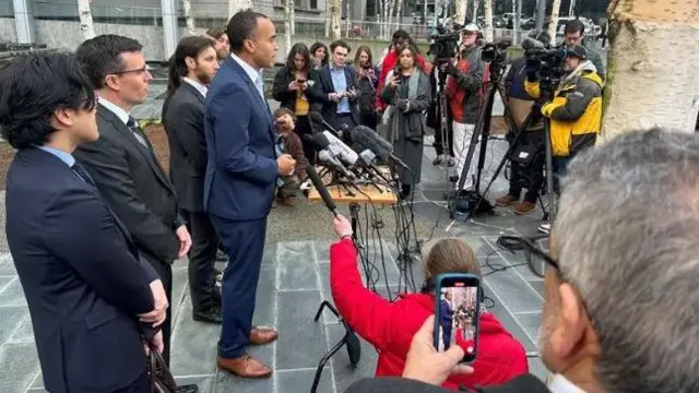 Washington state Attorney General Nicholas Brown celebrate di ruling inside news conference outside court