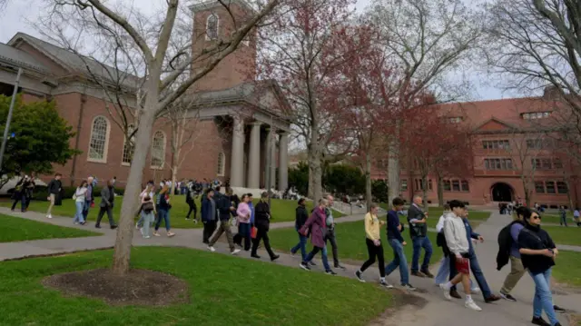Students walk on the campus of Harvard University in Cambridge, Massachusett 