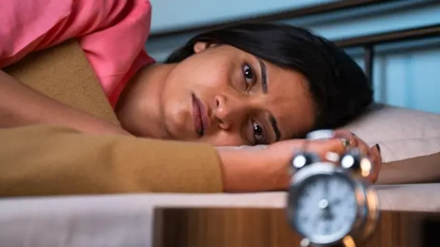 झोपलेली महिला