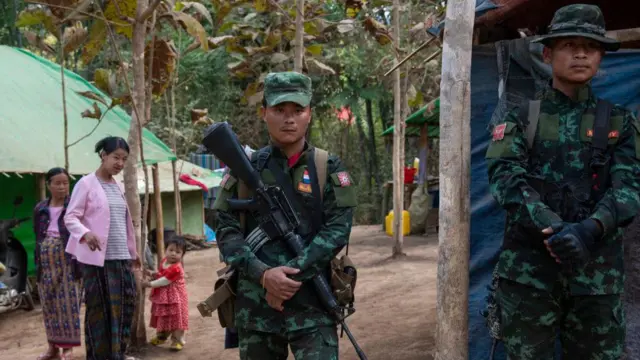 Soldiers from the Karenni Army, the armed wing of the Karenni National Progressive Party, one of the oldest ethnic guerrillas in Myanmar, stand in a camp for internally displaced people.