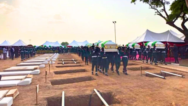Di burial ceremony as e dey happun for di national military cemetery wey dey Abuja