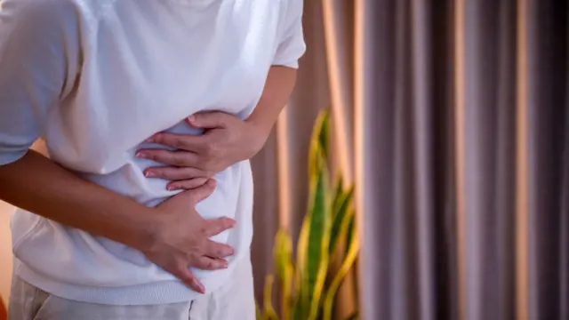 Woman holding her stomach