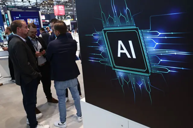 Una pantalla con un logo de IA en un centro de convenciones.