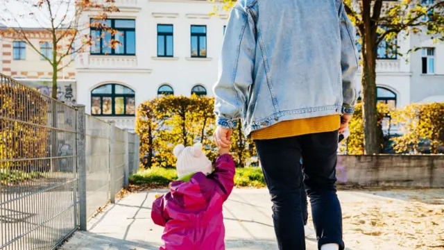 a man and a child walking