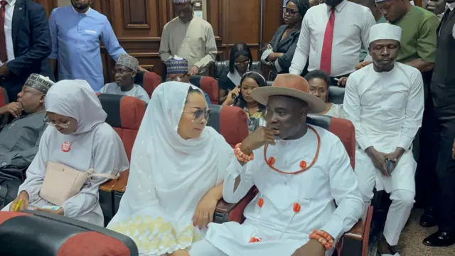 Natasha Akpoti-Uduaghan and her husband in court