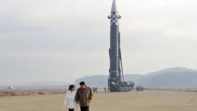 North Korea leader Kim Jong-un is seen standing hand-in-hand wit im daughter for dis foto released by KCNA news agency