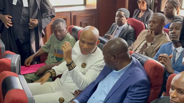 Nnamdi Kanu speaking with another man