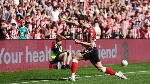Trai Hume celebrates with Sunderland supporters