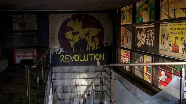 Photographs and artworks are seen inside the burnt office of The Daily Star newspaper in Dhaka after it was attacked.