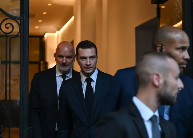 Jordan Bardella, President of the National Rally (Rassemblement National, RN), a French nationalist and right-wing populist party, leaves a Paris venue after delivering a speech to the media from around the world based on the partial results of the first round of the early French parliamentary elections, on 30 June 2024 in Paris, France