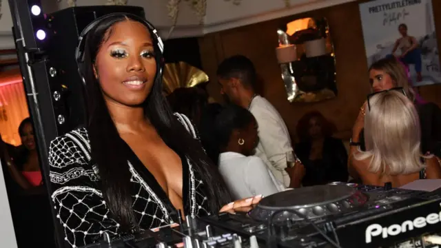 Nadia Jae behind one mixing desk