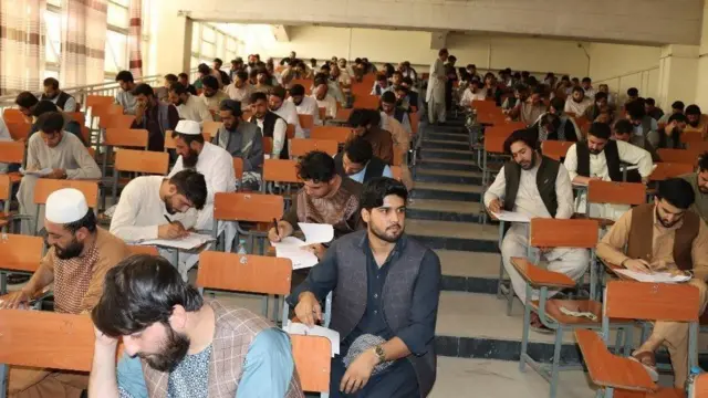 Male medical graduate taking part in the exit exam