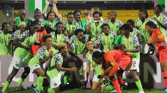 Nigeria players with medals around their necks celebrating their ninth title in 2018 with the Wafcon trophy