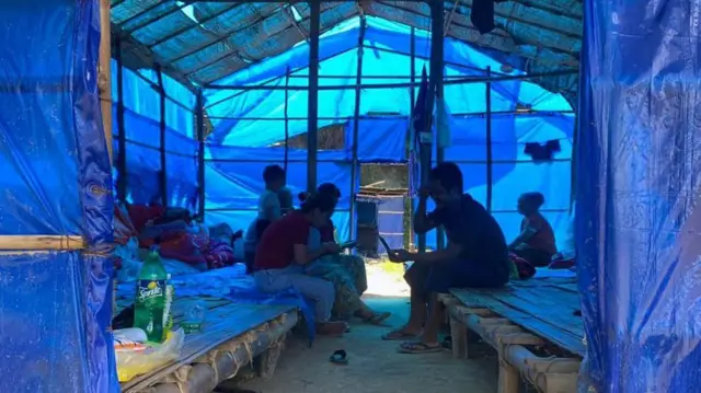 Refugees who fled Myanmar rest in a basic shelter at Farkawn quarantine camp in India's northeastern state of Mizoram near the Myanmar border on September 23, 2021, after they fled across the border following attacks by Myanmar's military on villages in western Chin state. 