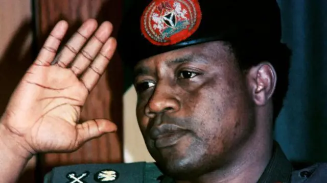 Ibrahim Babangida as e take salute for im military uniform
