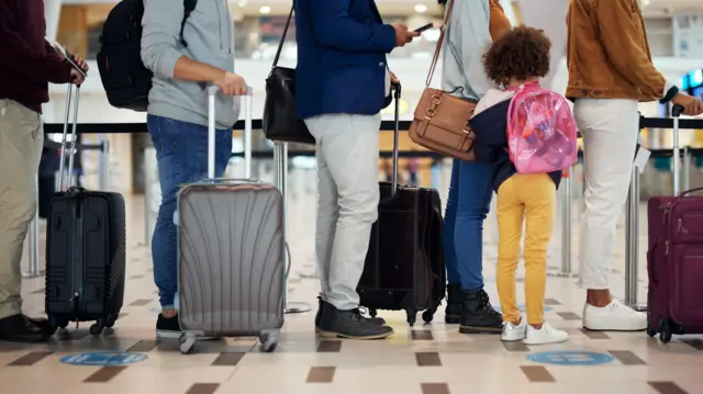 Airport queue, pipo wey wan travel for international vacation, holiday or immigration wit bag and small pikin.