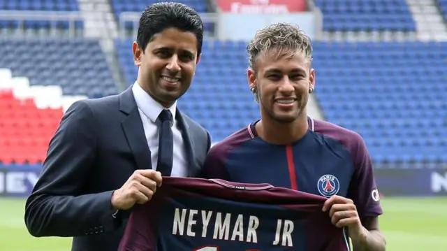 PSG president Nasser Al-Khelaifi pictured with Neymar at the Brazil forward's unveiling in 2017