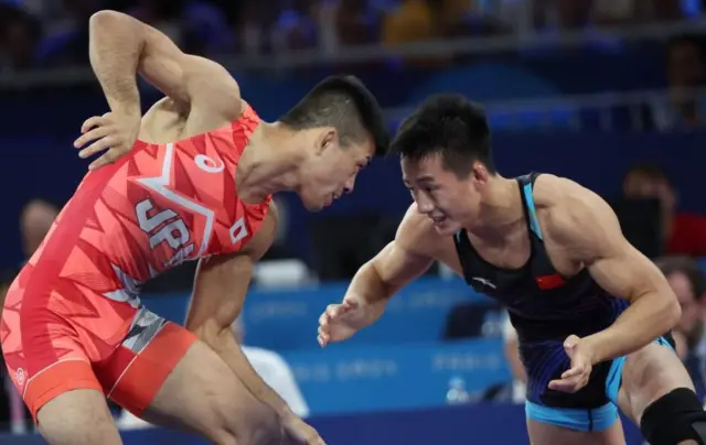 文田（左）と中国の曹