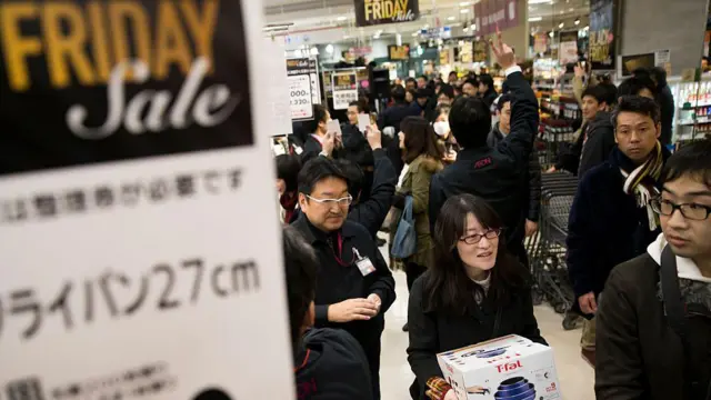 Customers shop during the Black Friday sale at a Tokyo supermarket in November 2016