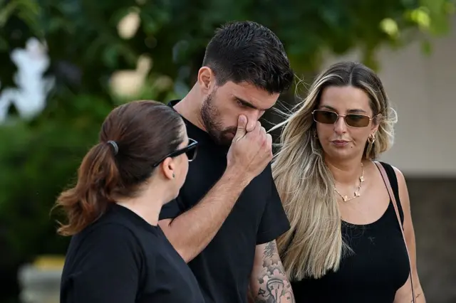 Ruben Neves, football player for Alhilal Saudi Club and the Portugal national team, and his wife Debora Lourenco arrive at a funeral held for Diogo Jota and his brother Andre Silva at Igreja Matriz de Gondomar