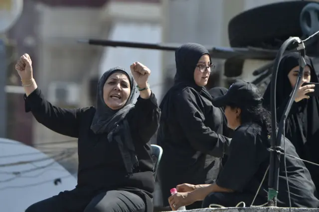 BEIRUT, LEBANON - AUGUST 09: Shia Muslims gather to attend mourning procession marking the day of Ashura in Beirut, Lebanon on August 09, 2022. Within Muharram month devotees commemorate the martyrdom of Prophet Muhammad's grandson Imam Hussein (Husayn Ibn Ali) along with 72 loyal companions, who was killed in the battle of Karbala in modern day Iraq in 680 AD. (Photo by Hussam Shbaro/Anadolu Agency via Getty Images)